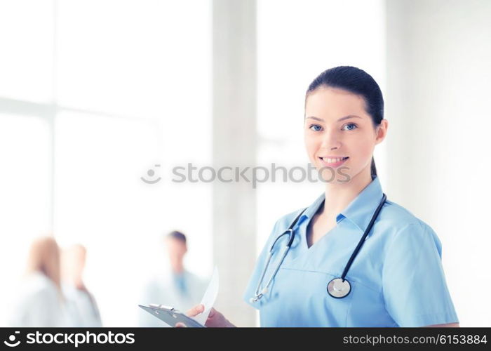 attractive female doctor or nurse in hospital. female doctor or nurse in hospital