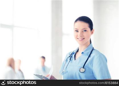 attractive female doctor or nurse in hospital. female doctor or nurse in hospital
