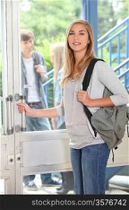 Attractive female student at entrance
