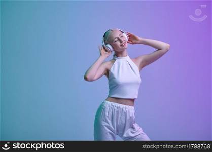 Attractive futuristic woman in white clothes and modern headphones. Sexy female person in virtual reality style, future technology, futurism concept. Attractive futuristic woman in modern headphones