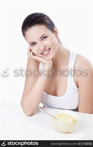 Attractive girl at breakfast on a white background