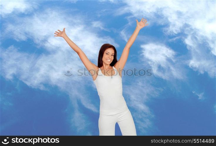Attractive girl dressed in white with a blue sky on background