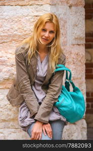 Attractive girl in courtyard the Palazzo della Ragione in Verona, Italy