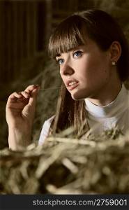 attractive girl in the hay. rural portrait