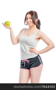 attractive girl in the sports form with green apple