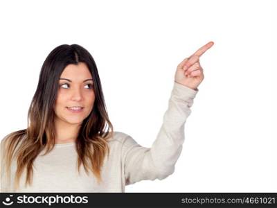 Attractive girl indicating something with the finger isolated on a white background