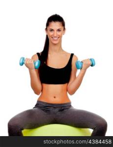 Attractive girl lifting weights sitting on a ball isolated on white background&#xA;