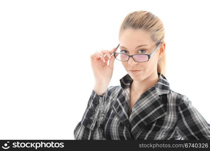 attractive girl looks through glasses. studio shot