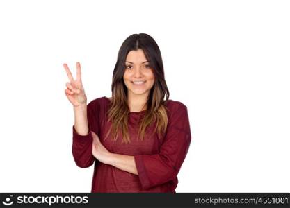 Attractive girl making the victory symbol isolated on white background