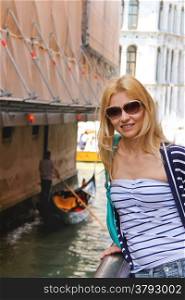 Attractive girl on a bridge in Venice, Italy