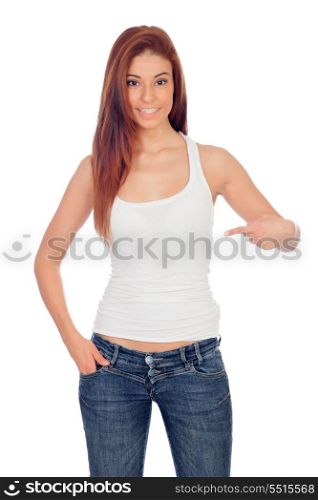 Attractive girl pointing something with her finger isolated on a white background