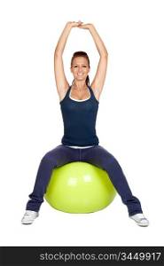 Attractive girl practicing pilates on a big green ball