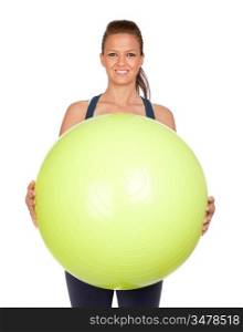 Attractive girl practicing pilates with a big green ball