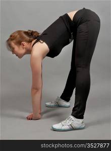 attractive girl shows various gymnastic exercises