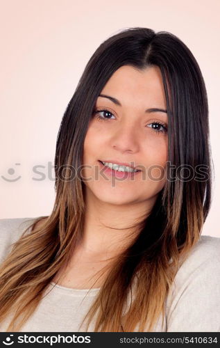 Attractive girl smiling isolated on a orange background