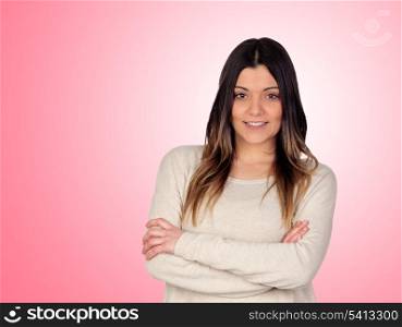 Attractive girl smiling with crossed arms isolated on pink background