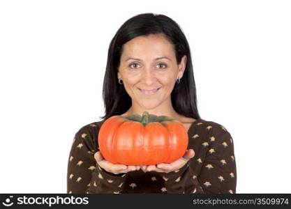 Attractive girl with a big pumpkin isolated on white background