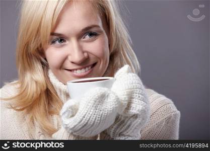 Attractive girl with a cup in his hand