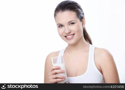 Attractive girl with a glass of milk on a white background