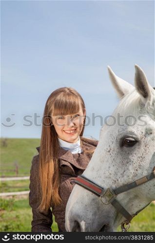 attractive girl with a horse on nature