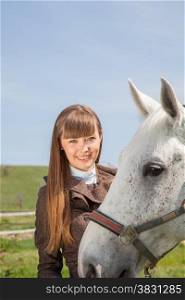 attractive girl with a horse on nature