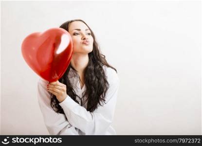 attractive girl with a red heart in the hands