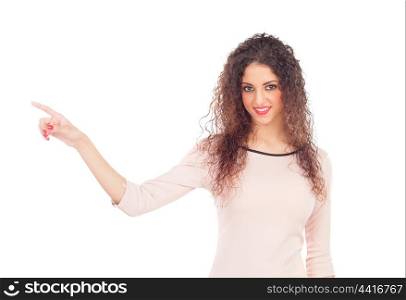 Attractive girl with big black eyes and the hand extended indicating something isolated on a white background