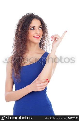 Attractive girl with big black eyes and the hand extended indicating something isolated on a white background