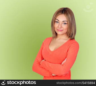 Attractive girl with blond hair isolated on green background