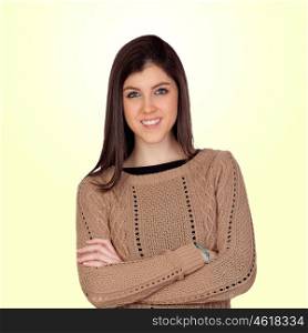 Attractive girl with crossed arms isolated on yellow background