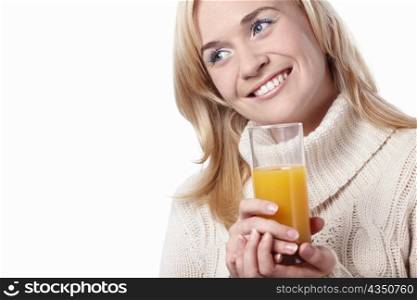 Attractive girl with the juice on a white background