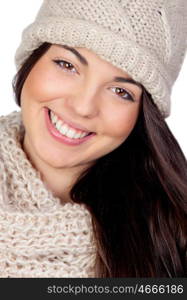 Attractive girl with with wool hat and scarf isolated on white background