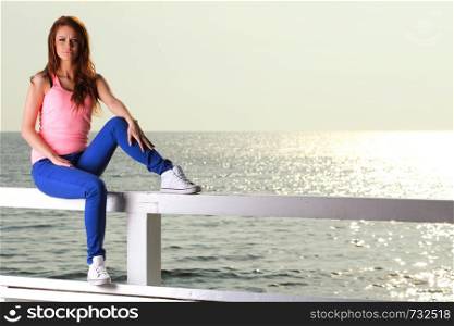 Attractive girl Young woman looking on background of sea sky