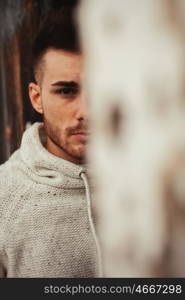 Attractive guy in a old house with white jersey