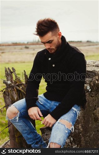 Attractive guy in the field. Photos for ads