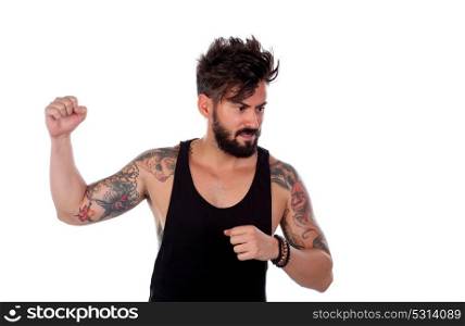 Attractive guy threatening with his fist raised isolated on a white background