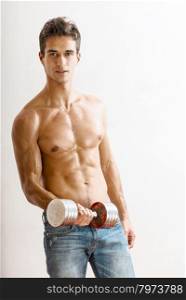 attractive guy training with dumbbells