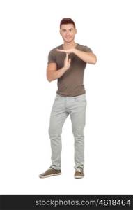 Attractive guy with spiky hair gesturing time-out isolated on white background
