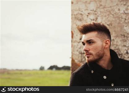 Attractive guy with the field of background. Photos for ads
