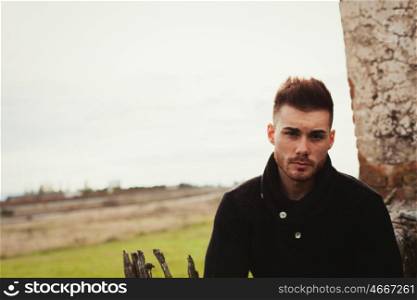 Attractive guy with the field of background. Photos for ads