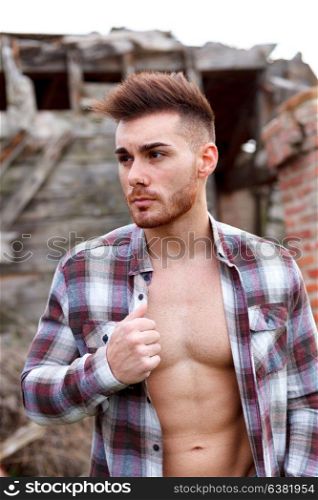 Attractive guy with the plaid shirt unbuttoned