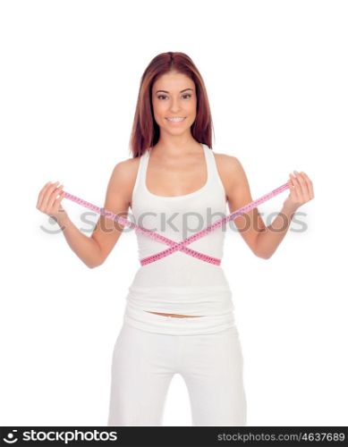 Attractive happy girl with a tape measure measuring her waist isolated on a white background