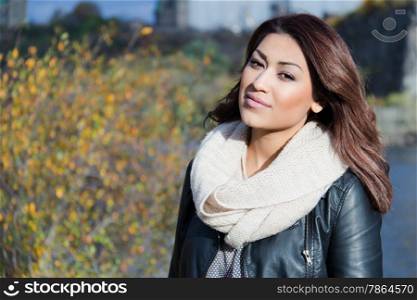 Attractive Hispanic woman outdoors during autumn