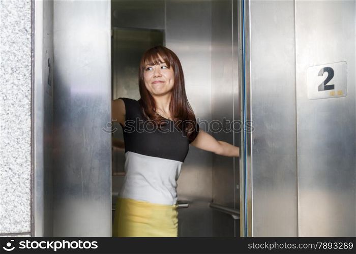 Attractive Japanese female at an elevator