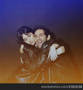 attractive lady hugging laughing guy leather jackets