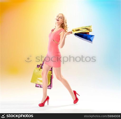 Attractive lady walking with shopping bags