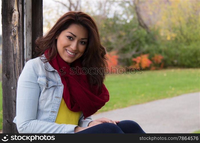 Attractive Latino woman outdoors during fall