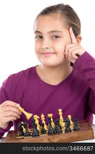 Attractive little girl playing chess on a over white background
