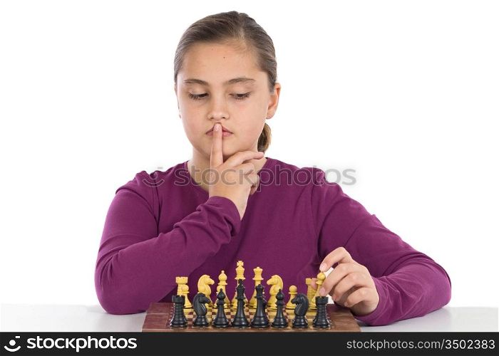 Attractive little girl playing chess on a over white background