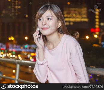 Attractive Malaysian Woman Talking on Phone